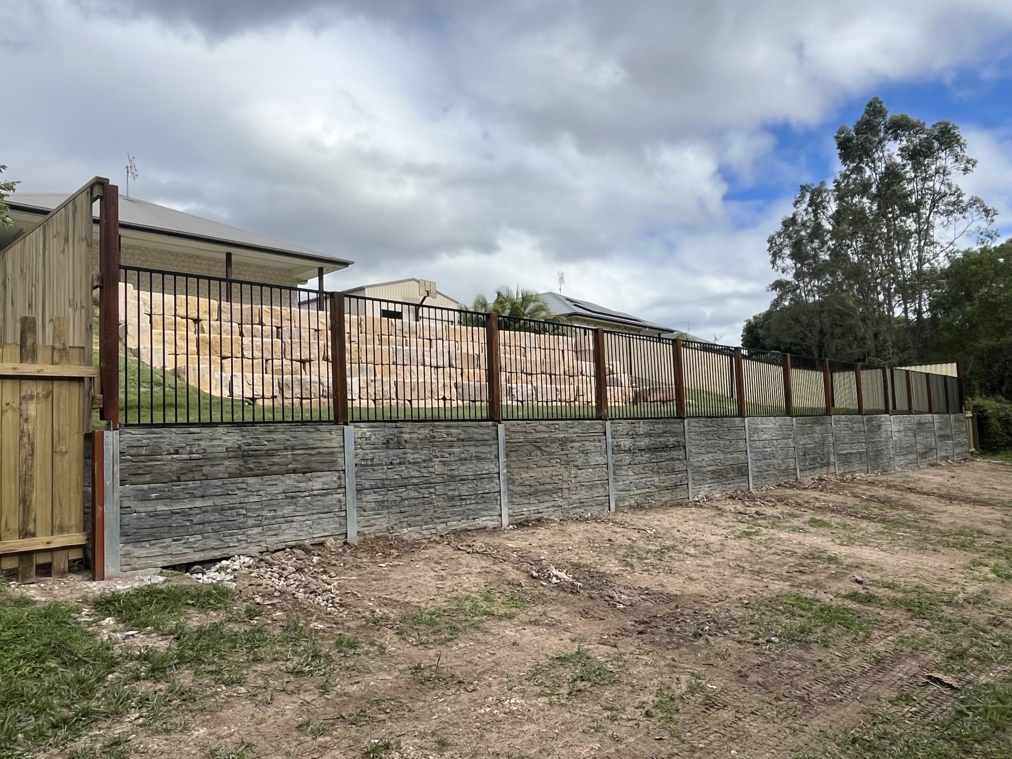 Completed retaining wall project by Digger Bro